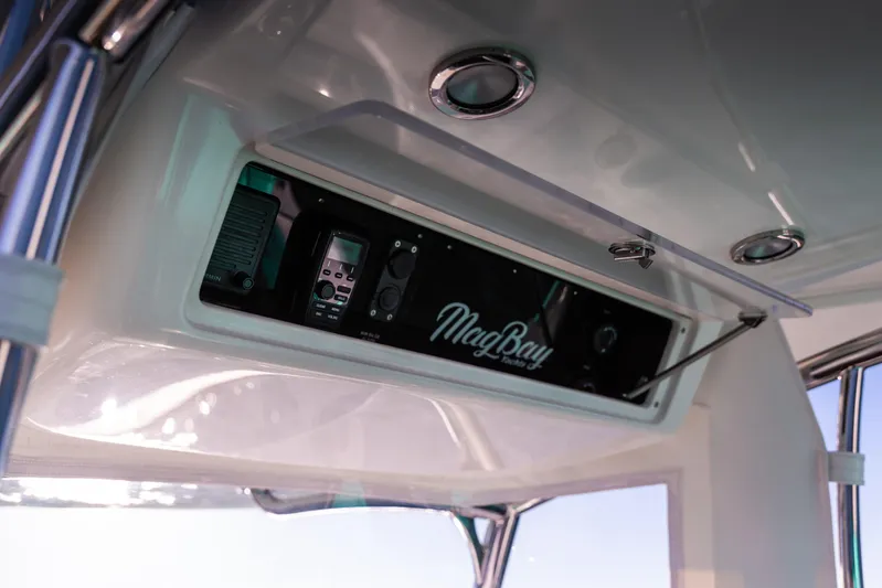 Toto II Yacht Photos Pics 2019 Mag Bay 33 CC boat console with electronic controls and logo.