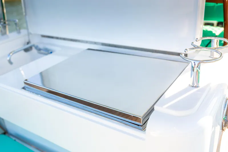 Toto II Yacht Photos Pics 2019 Mag Bay 33 CC boat with sleek stainless steel features and rod holders.