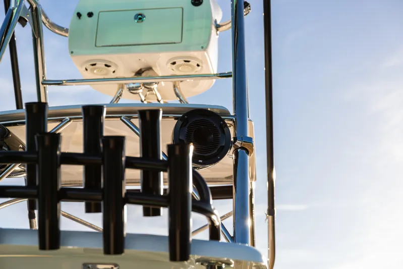 Toto II Yacht Photos Pics 2019 Mag Bay 33 CC boat tower with rod holders and speakers against blue sky.