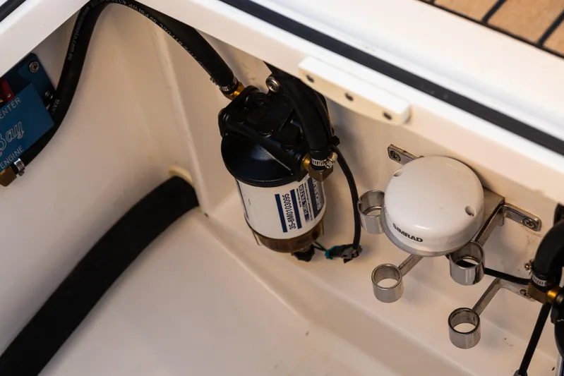 Toto II Yacht Photos Pics 2019 Mag Bay 33 CC boat engine compartment with Simrad equipment and fuel filter.