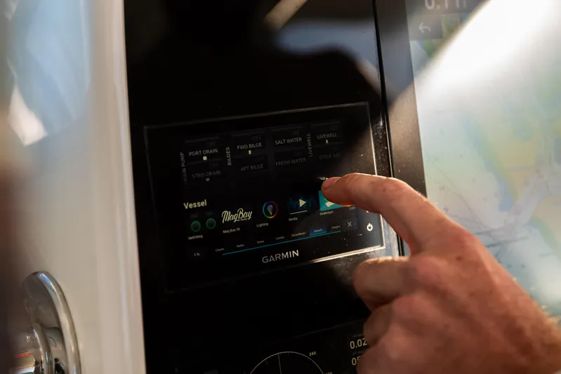 Toto II Yacht Photos Pics Touchscreen control panel on 2019 Mag Bay 33 CC boat, displaying vessel settings.