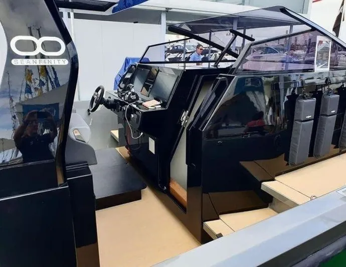 Seafinity Yacht Photos Pics 2019 Seanfinity TS48 boat interior with sleek black design and modern controls.