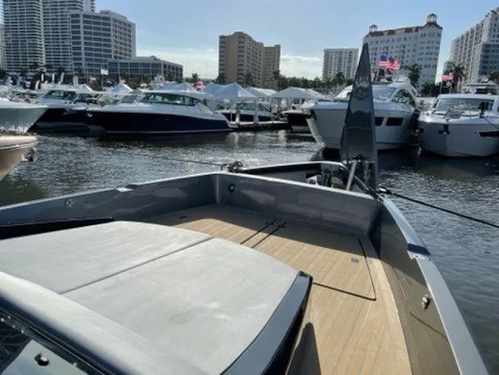 Seafinity Yacht Photos Pics 2019 Seanfinity TS48 yacht docked at marina with city skyline.