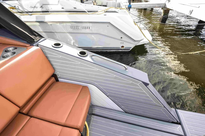 Sea Ya Later Yacht Photos Pics 2021 Cruisers Yachts 42 GLS OB, featuring sleek seating and modern design at a marina.