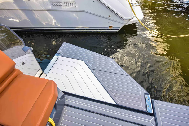 Sea Ya Later Yacht Photos Pics 2021 Cruisers Yachts 42 GLS OB swim platform with water reflection.