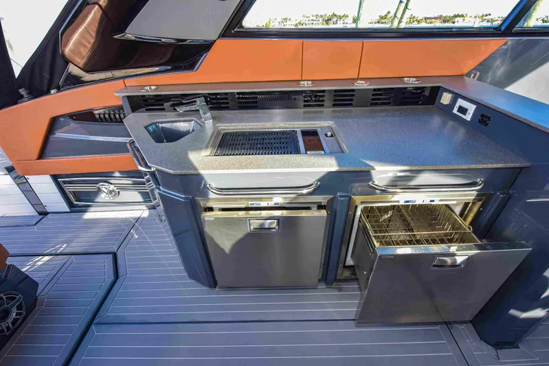 Sea Ya Later Yacht Photos Pics Modern kitchen area on 2021 Cruisers Yachts 42 GLS OB with appliances and sleek design.