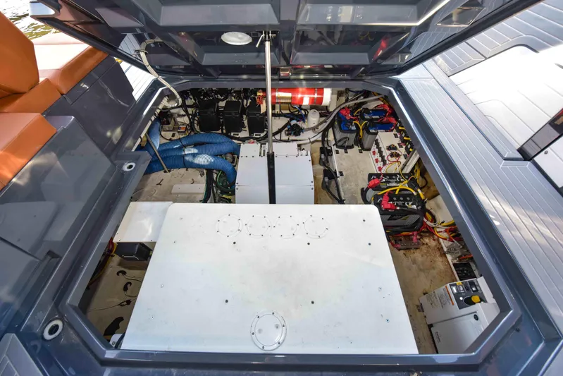 Sea Ya Later Yacht Photos Pics Engine compartment of 2021 Cruisers Yachts 42 GLS OB, showcasing mechanical components and wiring.