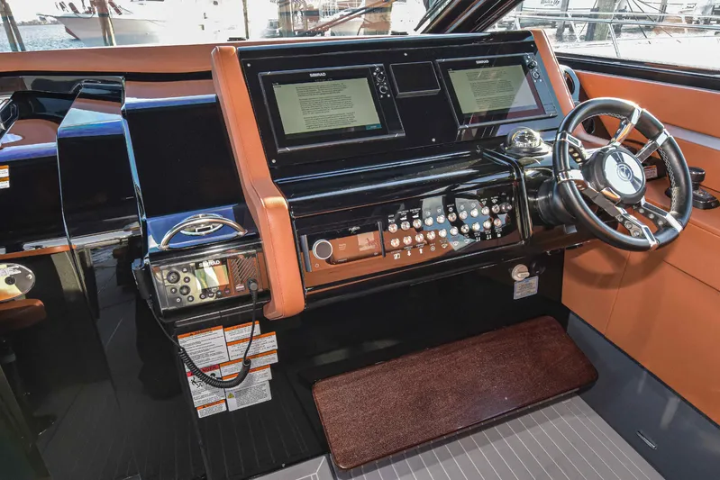 Sea Ya Later Yacht Photos Pics Helm of 2021 Cruisers Yachts 42 GLS OB with modern controls and dual displays.