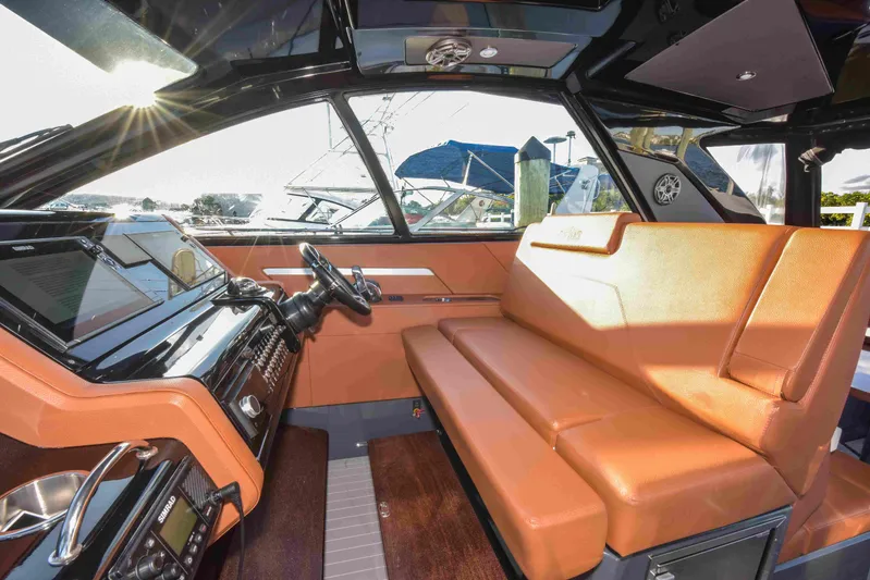 Sea Ya Later Yacht Photos Pics Interior of 2021 Cruisers Yachts 42 GLS OB with luxurious seating and modern dashboard.