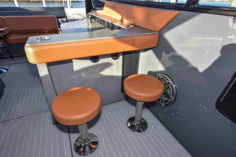 Sea Ya Later Yacht Photos Pics 2021 Cruisers Yachts 42 GLS OB interior with bar stools and counter.