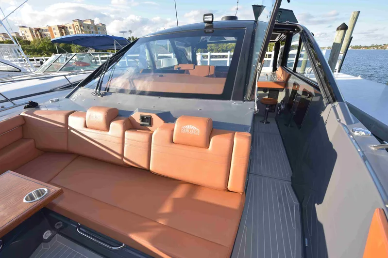 Sea Ya Later Yacht Photos Pics 2021 Cruisers Yachts 42 GLS OB with luxurious seating and sleek design at a marina.