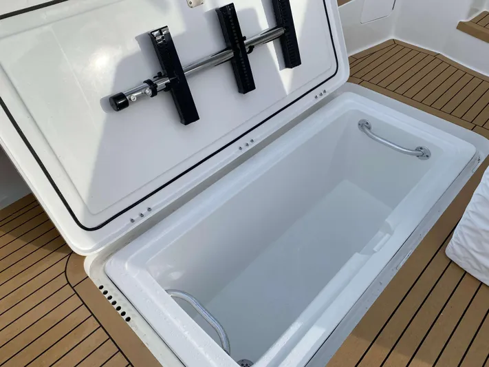  Yacht Photos Pics Open storage compartment on 2021 Henriques 42 Express Hardtop Bridge boat deck.
