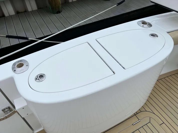  Yacht Photos Pics Henriques 42 Express Hardtop Bridge 2021, deck view with storage compartments.