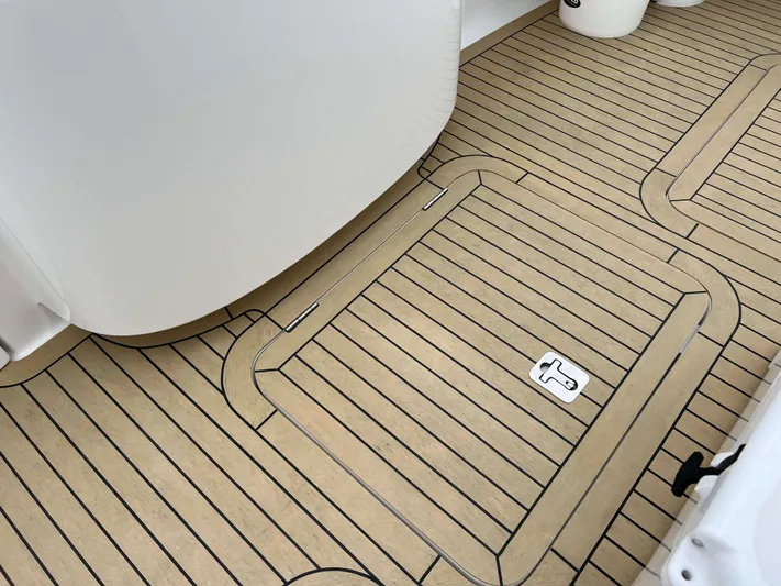  Yacht Photos Pics Henriques 42 Express Hardtop Bridge 2021, featuring sleek, modern deck design with wood-like finish.