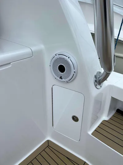  Yacht Photos Pics 2021 Henriques 42 Express Hardtop Bridge interior with speaker and sleek design.