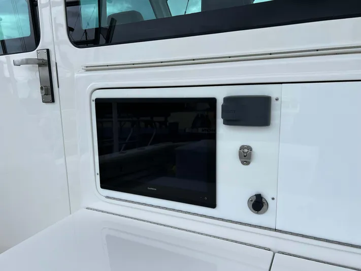  Yacht Photos Pics Henriques 42 Express Hardtop Bridge 2021 control panel with sleek design and modern features.