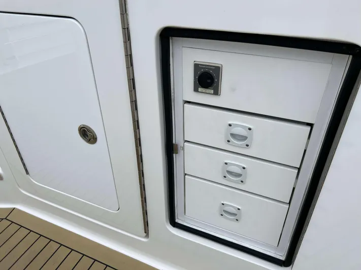  Yacht Photos Pics Henriques 42 Express Hardtop Bridge 2021, white storage drawers and compartment on deck.