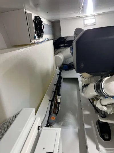  Yacht Photos Pics Engine room of 2021 Henriques 42 Express Hardtop Bridge, showcasing mechanical components.