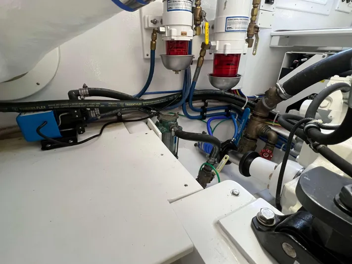  Yacht Photos Pics Engine room of 2021 Henriques 42 Express Hardtop Bridge with fuel filters and hoses.