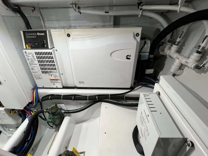  Yacht Photos Pics Engine room of 2021 Henriques 42 Express Hardtop Bridge with Cummins Onan generator.