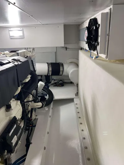  Yacht Photos Pics Engine room of 2021 Henriques 42 Express Hardtop Bridge, showcasing machinery and ventilation.