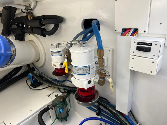  Yacht Photos Pics Engine room of 2021 Henriques 42 Express Hardtop Bridge with fuel filters and wiring.