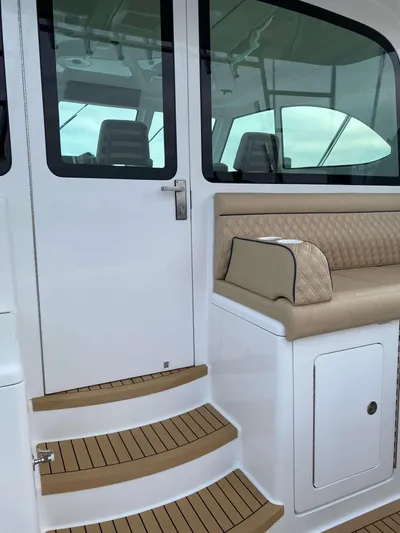 Yacht Photos Pics 2021 Henriques 42 Express Hardtop Bridge, elegant seating and steps detail.