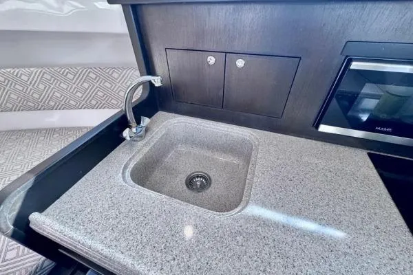 Seanior Moment Yacht Photos Pics Modern kitchen sink area in 2022 Stamas 370 Aegean boat, featuring sleek countertop design.