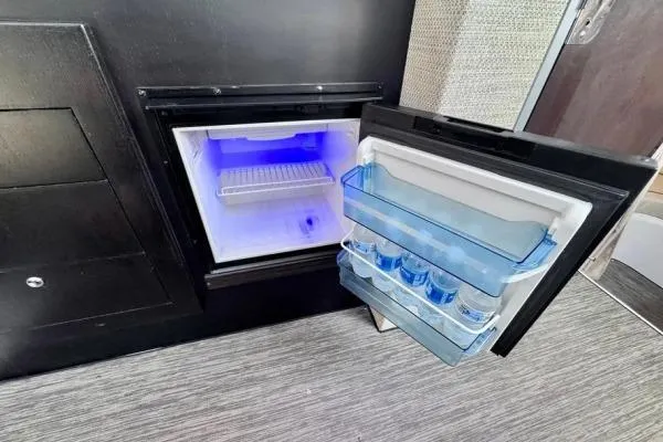 Seanior Moment Yacht Photos Pics Compact refrigerator in 2022 Stamas 370 Aegean yacht, open with water bottles inside.