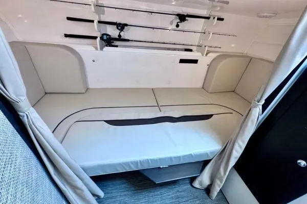 Seanior Moment Yacht Photos Pics 2022 Stamas 370 Aegean cabin interior with fishing rods and comfortable seating.