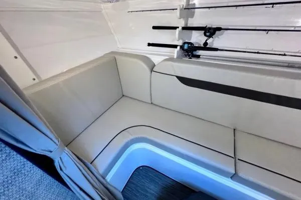Seanior Moment Yacht Photos Pics 2022 Stamas 370 Aegean interior with beige seating and fishing rods.