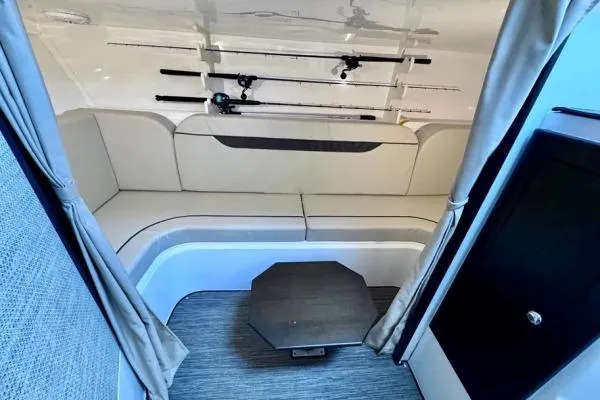 Seanior Moment Yacht Photos Pics Interior of 2022 Stamas 370 Aegean boat with seating and fishing rods.