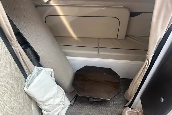 Seanior Moment Yacht Photos Pics Interior of 2022 Stamas 370 Aegean boat with beige seating and wooden table.