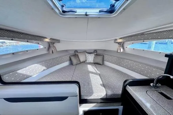 Seanior Moment Yacht Photos Pics Luxurious interior of 2022 Stamas 370 Aegean yacht with elegant seating and skylight.