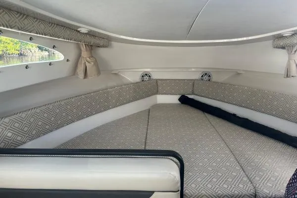 Seanior Moment Yacht Photos Pics Interior cabin of 2022 Stamas 370 Aegean boat with patterned seating and windows.