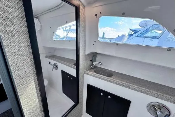 Seanior Moment Yacht Photos Pics 2022 Stamas 370 Aegean boat interior with modern bathroom and window view.