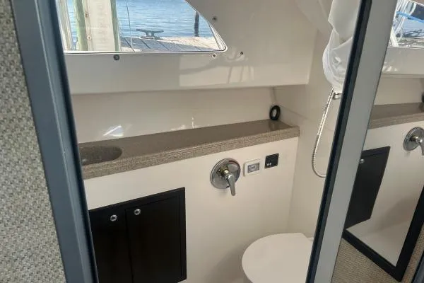 Seanior Moment Yacht Photos Pics 2022 Stamas 370 Aegean boat interior bathroom with modern fixtures and window view.