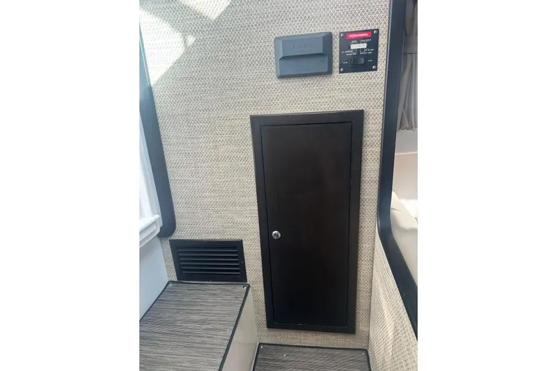 Seanior Moment Yacht Photos Pics Interior of 2022 Stamas 370 Aegean boat with control panel and storage cabinet.