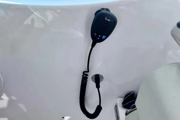 Seanior Moment Yacht Photos Pics VHF radio microphone on 2022 Stamas 370 Aegean boat dashboard.