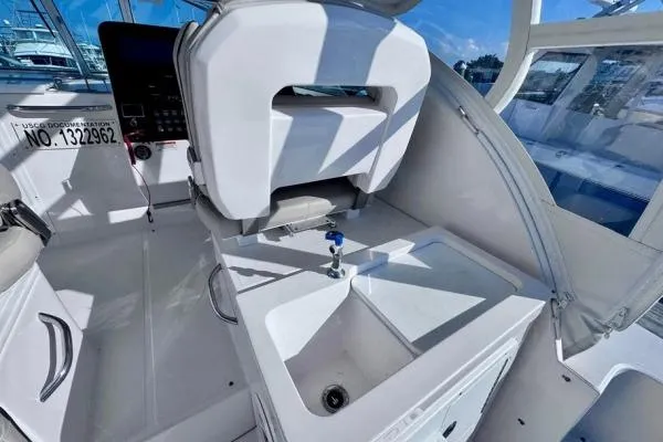 Seanior Moment Yacht Photos Pics 2022 Stamas 370 Aegean boat interior with helm seat and sink, showcasing modern design.