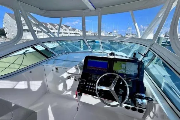 Seanior Moment Yacht Photos Pics 2022 Stamas 370 Aegean boat cockpit with navigation equipment and marina view.