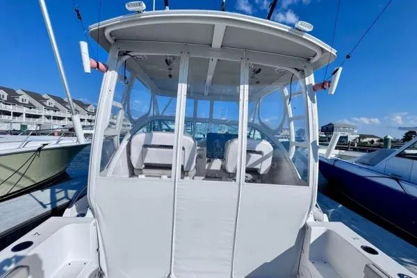 Seanior Moment Yacht Photos Pics 2022 Stamas 370 Aegean boat docked, featuring enclosed cockpit and clear skies.