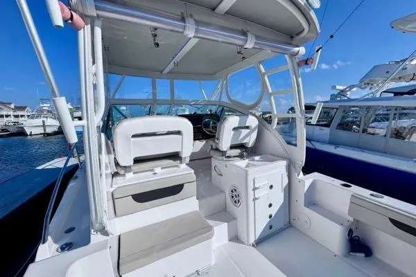 Seanior Moment Yacht Photos Pics 2022 Stamas 370 Aegean boat interior with helm, seating, and clear blue sky.