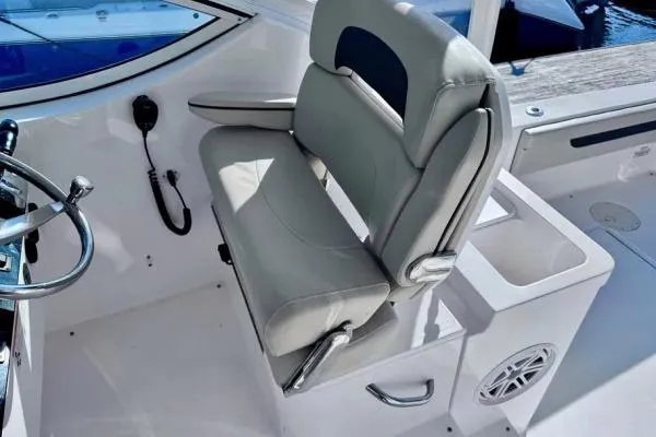 Seanior Moment Yacht Photos Pics 2022 Stamas 370 Aegean boat helm seat with steering wheel and control panel.