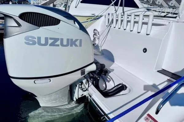 Seanior Moment Yacht Photos Pics 2022 Stamas 370 Aegean boat with Suzuki outboard motor, docked at marina.