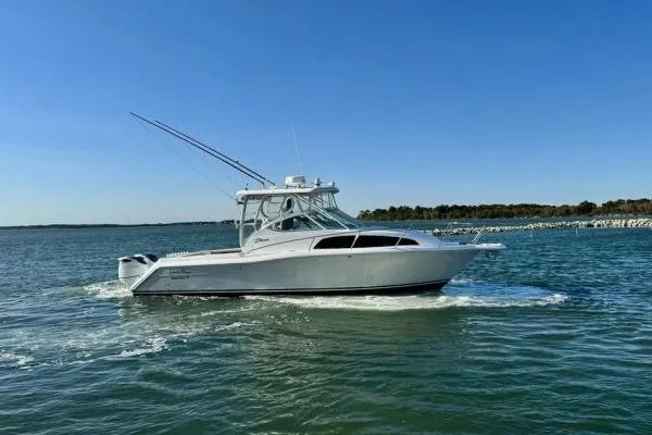Seanior Moment Yacht Photos Pics 2022 Stamas 370 Aegean boat cruising on open water under clear blue sky.