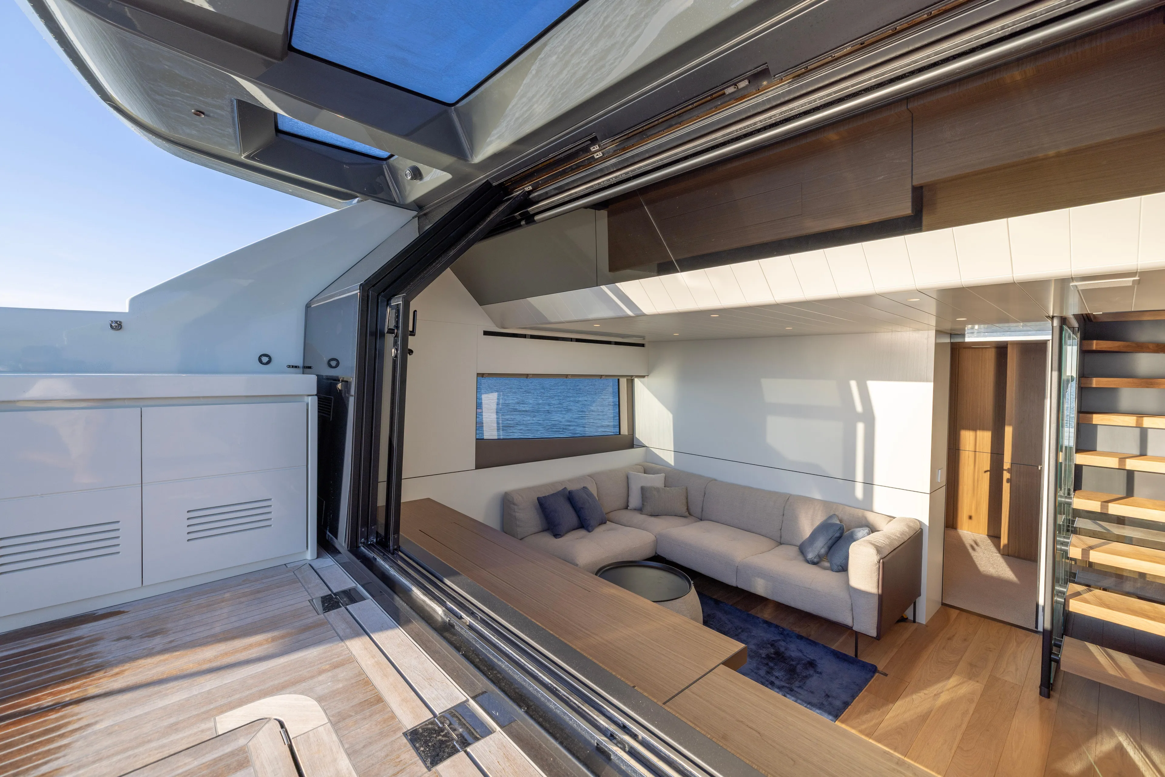 The Calm Down Yacht Photos Pics Luxurious interior of 2024 Bluegame BGX63 yacht with modern design and spacious seating.