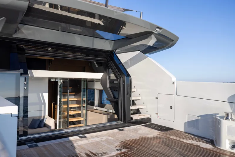 The Calm Down Yacht Photos Pics 2024 Bluegame BGX63 yacht interior with modern design and open deck view.