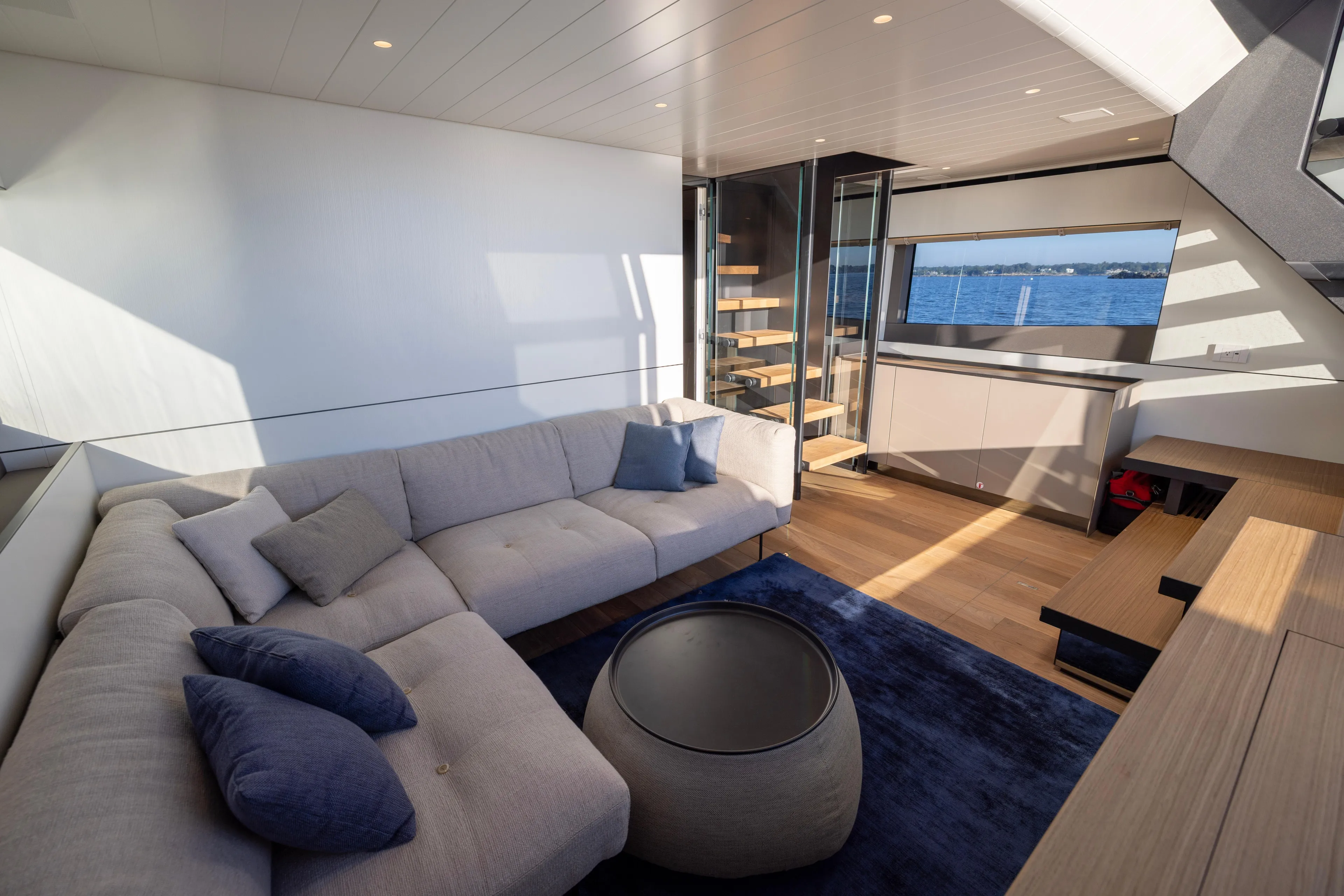 The Calm Down Yacht Photos Pics Luxurious interior of 2024 Bluegame BGX63 yacht with modern design and ocean view.