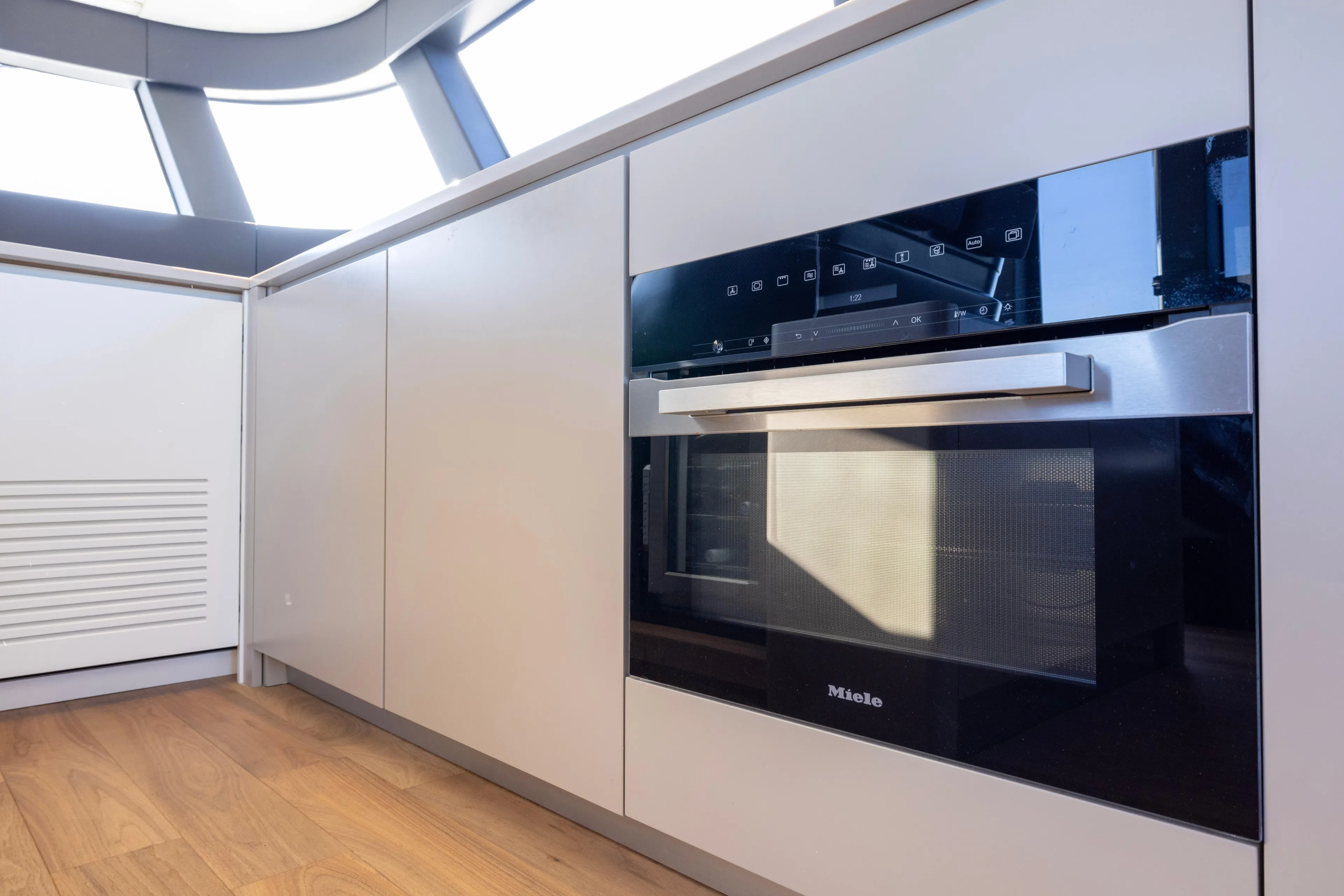 The Calm Down Yacht Photos Pics Modern kitchen interior on 2024 Bluegame BGX63 yacht with Miele oven.